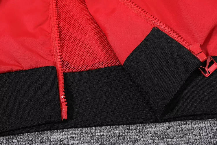 AC Milan red hooded windbreaker.