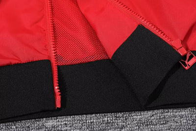 AC Milan red hooded windbreaker.