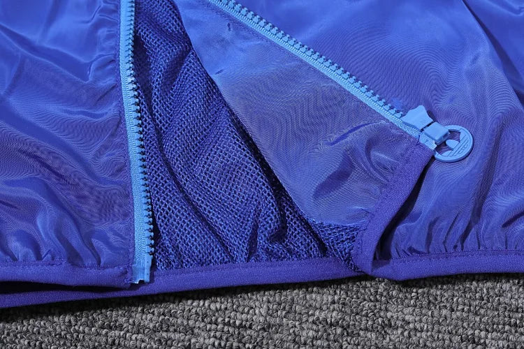 Lyon's blue hooded windbreaker
