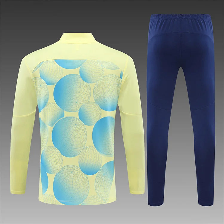 2024/25 Manchester City light yellow long sleeve training kit.