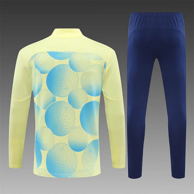 2024/25 Manchester City light yellow long sleeve training kit.
