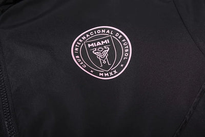 Miami black hooded trench coat.