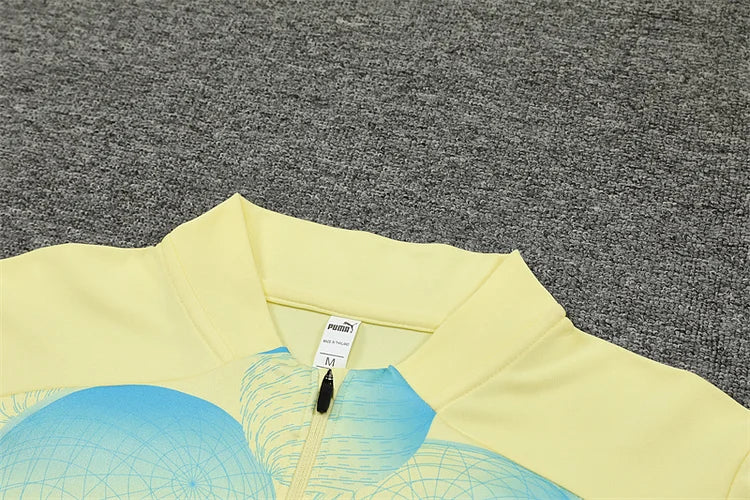 2024/25 Manchester City light yellow long sleeve training kit.