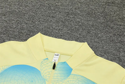 2024/25 Manchester City light yellow long sleeve training kit.