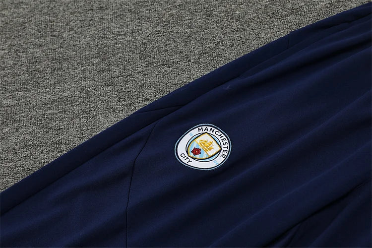 2024/25 Manchester City light yellow long sleeve training kit.