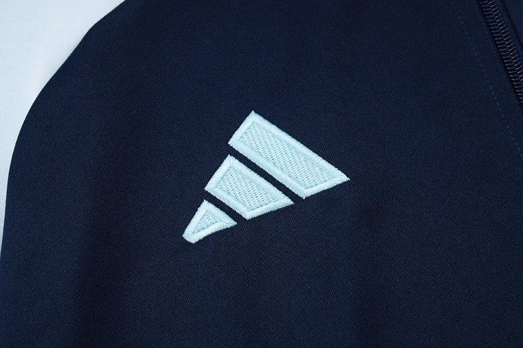 2024/25 Real Madrid blue jacket.
