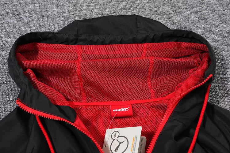 AC Milan red hooded windbreaker.