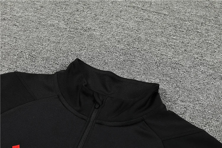 2023/24 Manchester United Half-Zip Long Sleeve Training Kit.