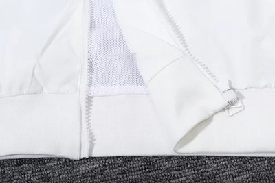White hooded windbreaker from Tottenham Hotspur.