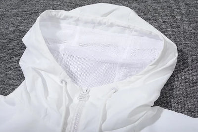 White hooded windbreaker from Tottenham Hotspur.